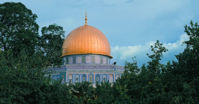The iconic Dome of the Rock shines brightly amidst lush greenery, a symbol of Jerusalem's rich history and religion.