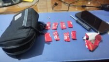 Barang Bukti delapan paket yang dibungkus lakban merah bertuliskan