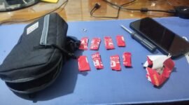Barang Bukti delapan paket yang dibungkus lakban merah bertuliskan 